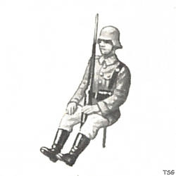 Lineol Soldat sitzend, mit Gewehr